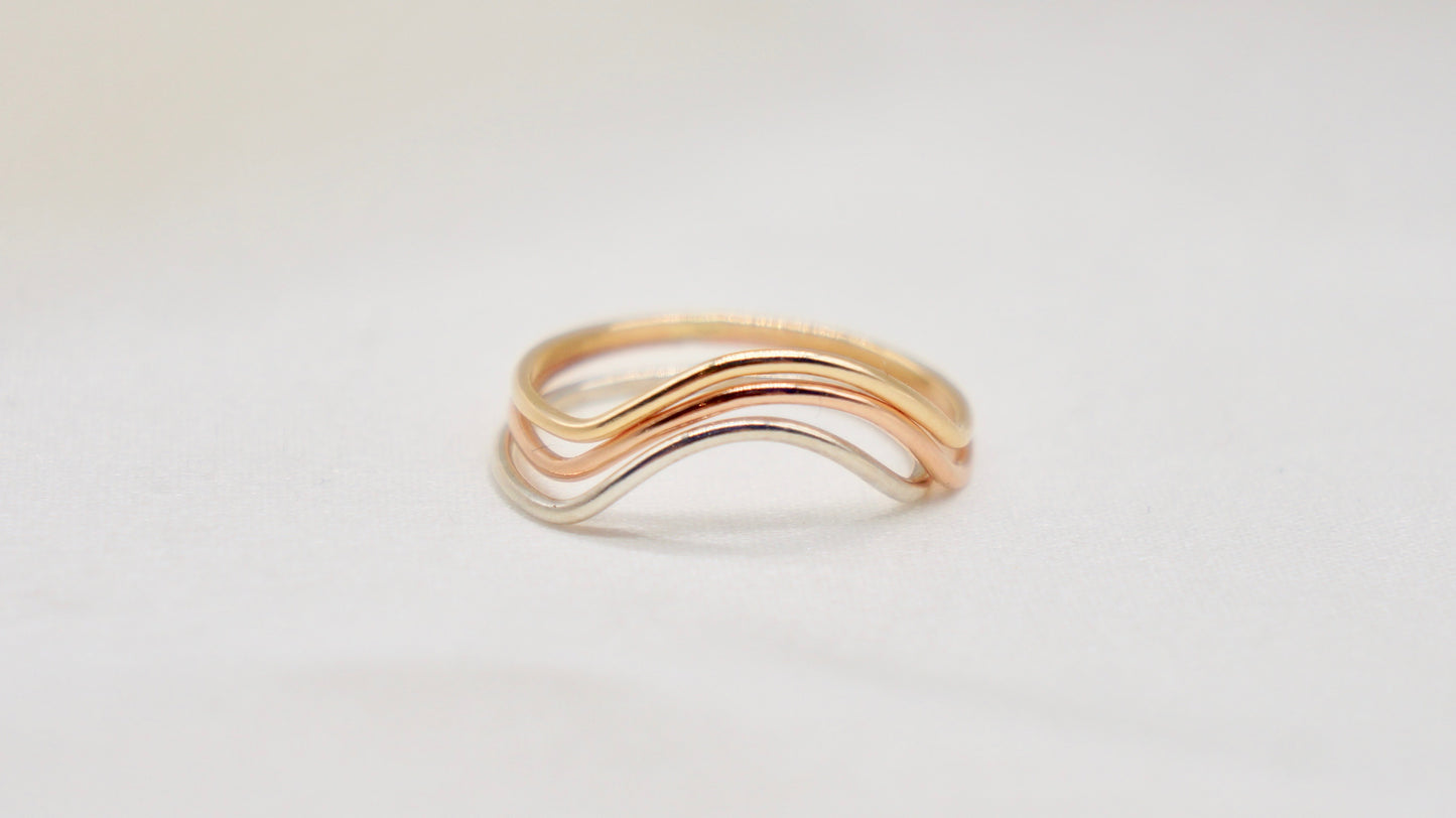 With a simple arc, the Arc ring adds a flair to your ring stack. hammered texture 14k gold filled, rose gold filled or 92.5 sterling silver handmade in Los Angeles