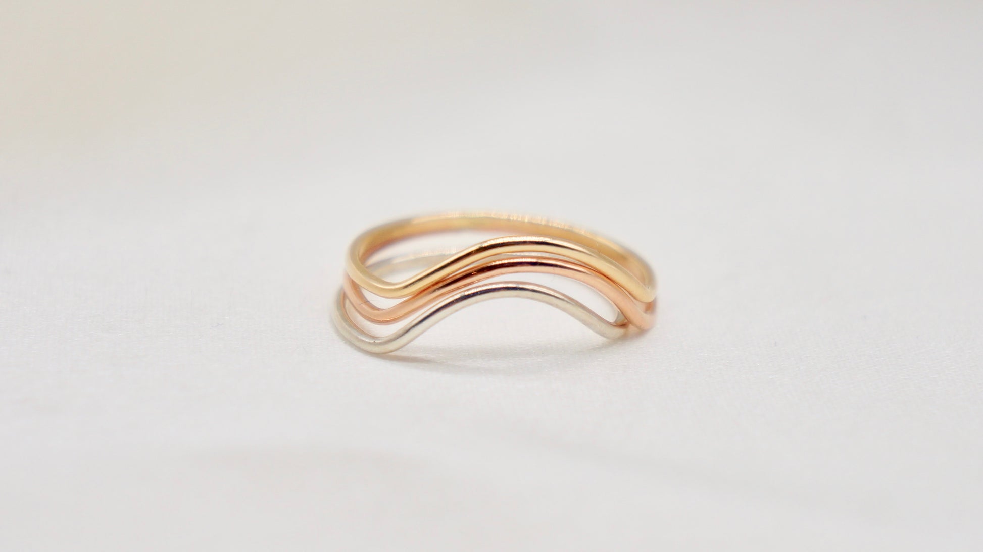 With a simple arc, the Arc ring adds a flair to your ring stack.   hammered texture 14k gold filled, rose gold filled or 92.5 sterling silver handmade in Los Angeles 