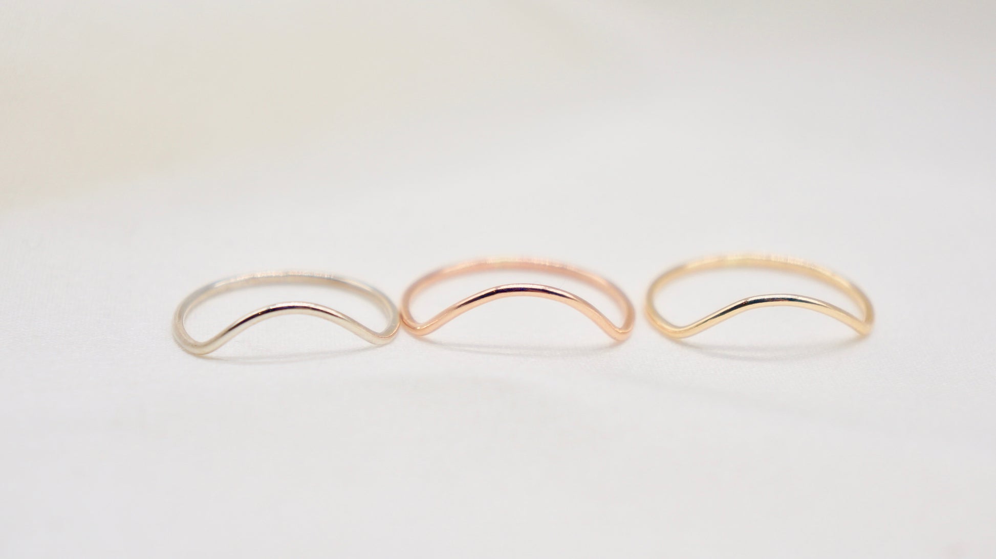 With a simple arc, the Arc ring adds a flair to your ring stack.   hammered texture 14k gold filled, rose gold filled or 92.5 sterling silver handmade in Los Angeles