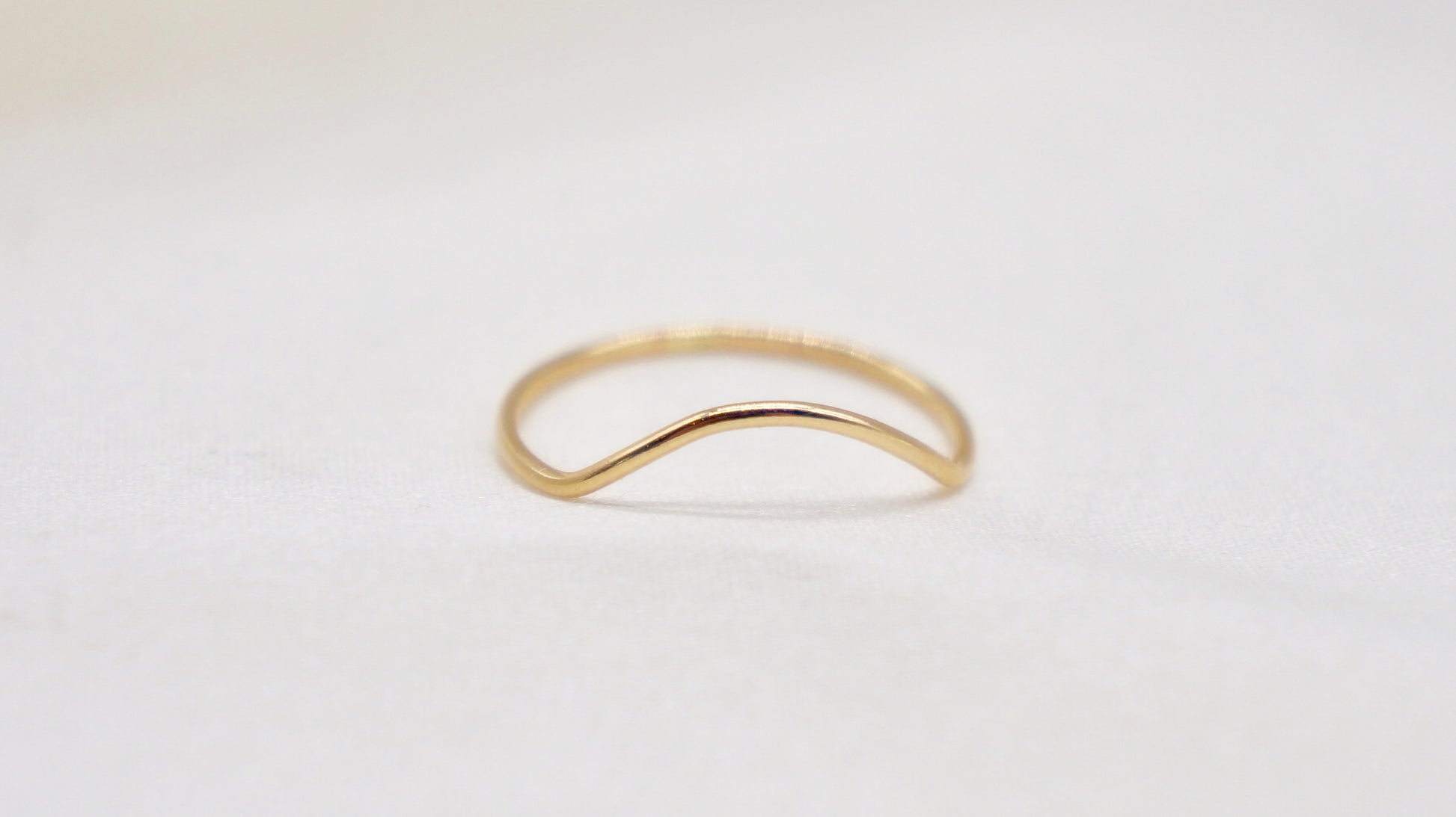 With a simple arc, the Arc ring adds a flair to your ring stack.   hammered texture 14k gold filled, rose gold filled or 92.5 sterling silver handmade in Los Angeles