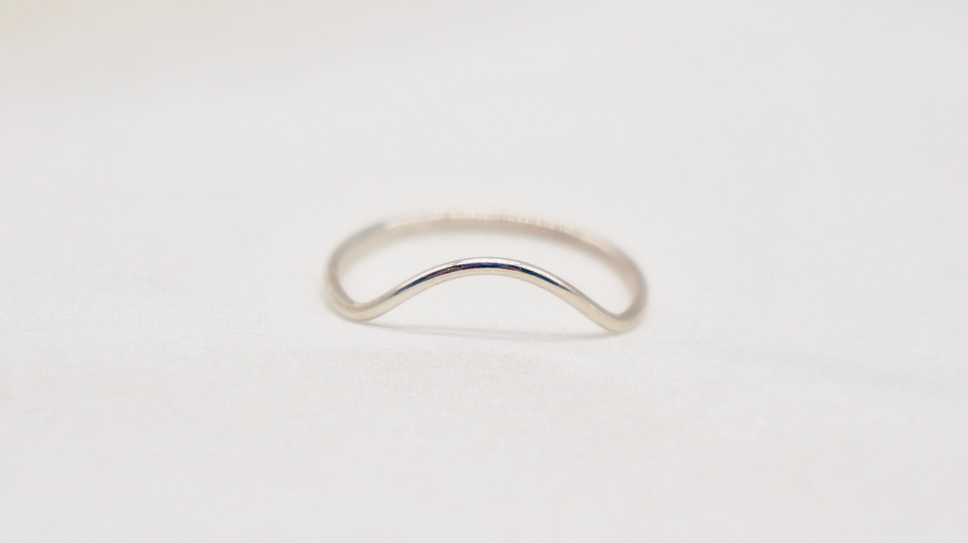 With a simple arc, the Arc ring adds a flair to your ring stack.   hammered texture 14k gold filled, rose gold filled or 92.5 sterling silver handmade in Los Angeles 