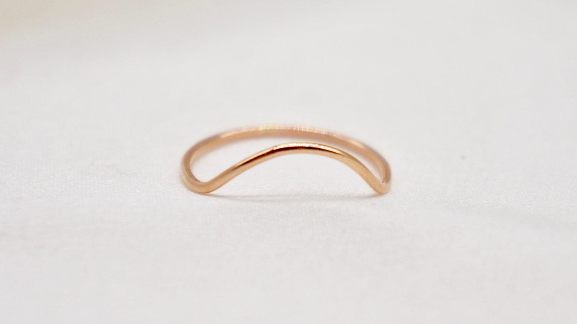 With a simple arc, the Arc ring adds a flair to your ring stack.   hammered texture 14k gold filled, rose gold filled or 92.5 sterling silver handmade in Los Angeles 